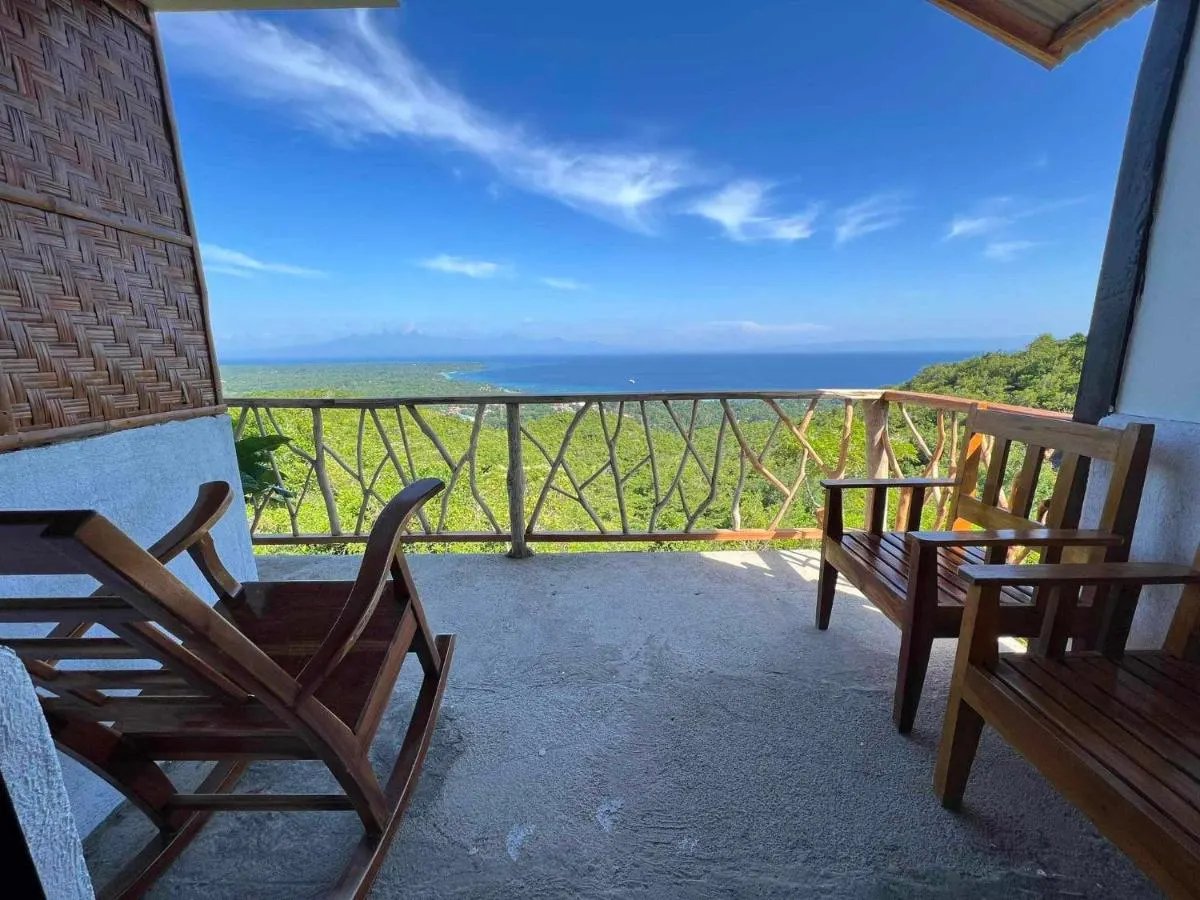 Rocking chairs on a balcony with sea view