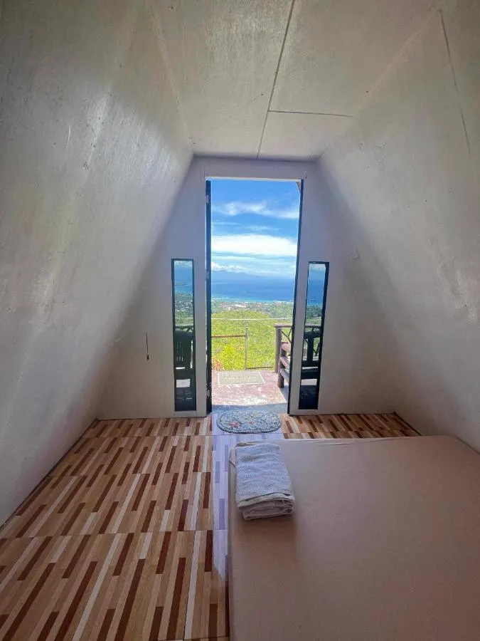 Inside the casita, door open to the sea