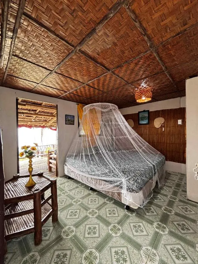 Bamboo cottage with a mosquito net over the bed