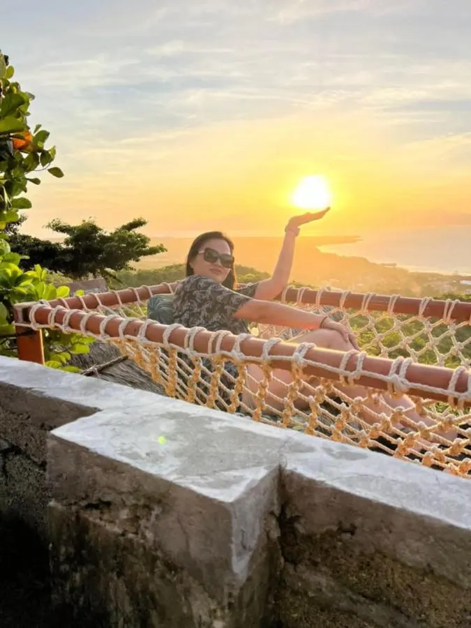 Holding the sun at sunset