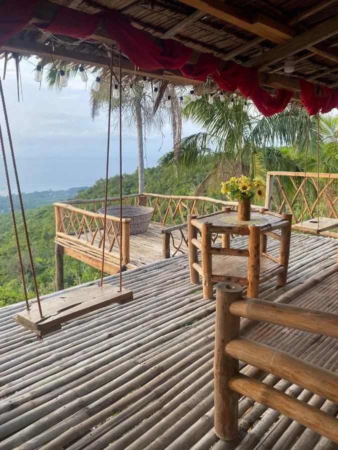 The deck with swings over the jungle